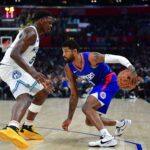 Feb 12, 2024; Los Angeles, California, USA; Los Angeles Clippers forward Paul George (13) moves the ball against Minnesota Timberwolves guard Anthony Edwards (5) during the second half at Crypto.com Arena. Mandatory Credit: Gary A. Vasquez-USA TODAY Sports