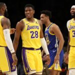 Oct 13, 2023; Los Angeles, California, USA; Los Angeles Lakers forward Rui Hachimura (28) smiles with forward LeBron James (23) and forward Anthony Davis (3) during the first half against the Golden State Warriors at Crypto.com Arena. Mandatory Credit: Kiyoshi Mio-USA TODAY Sports