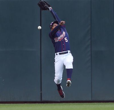 Minnesota Twins left fielder Eduardo Escobar (5) could not come with this catch on a ball hit by Oakland Athletics first baseman Ike Davis (17) in the third inning Thursday May 7, 2015 in Minneapolis, MN. The Minnesota Twins hosted the Oakland A’s at Targ