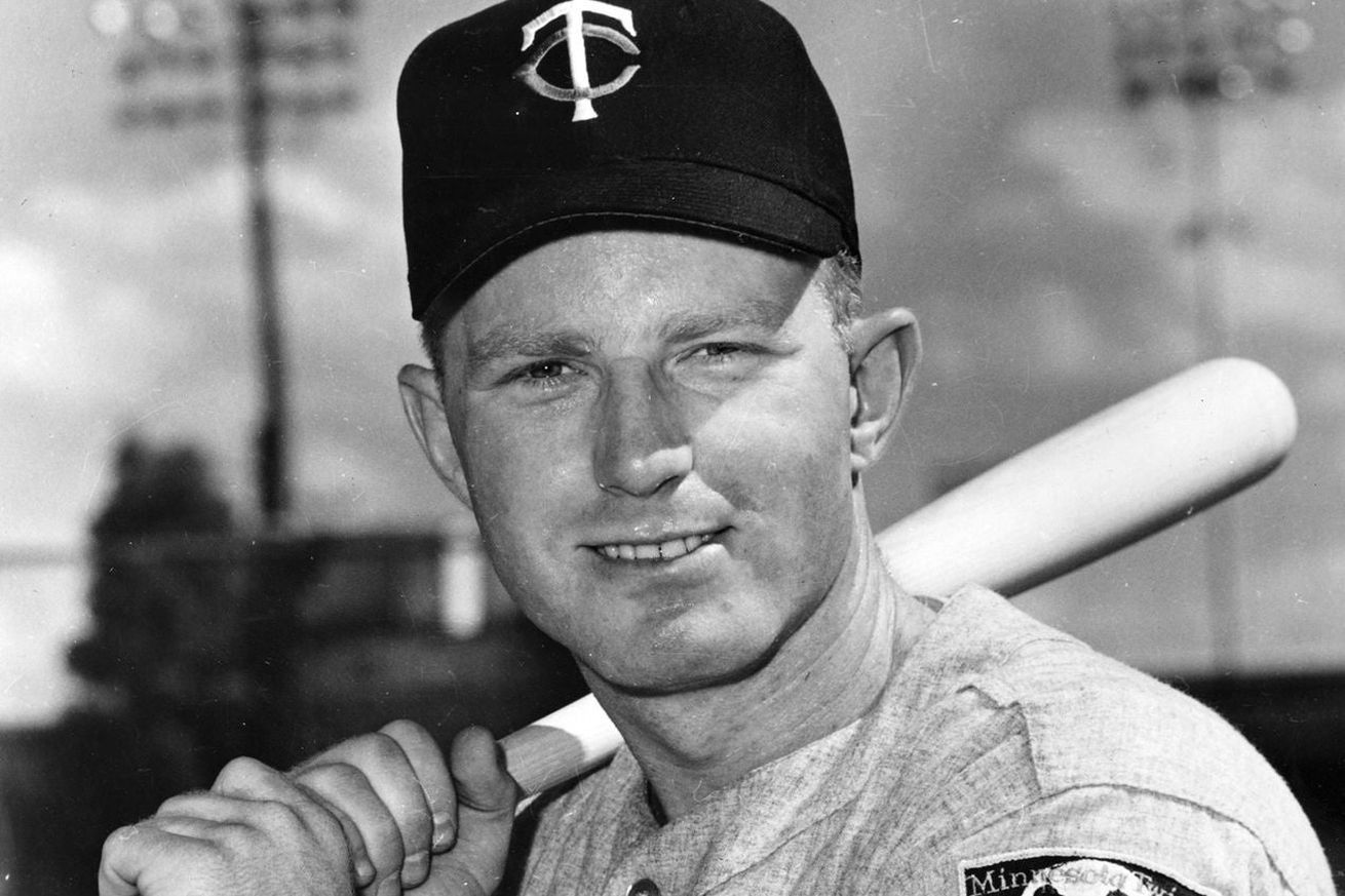 Publicity photo of Twins player Rich Rollins smiling and holding a bat.