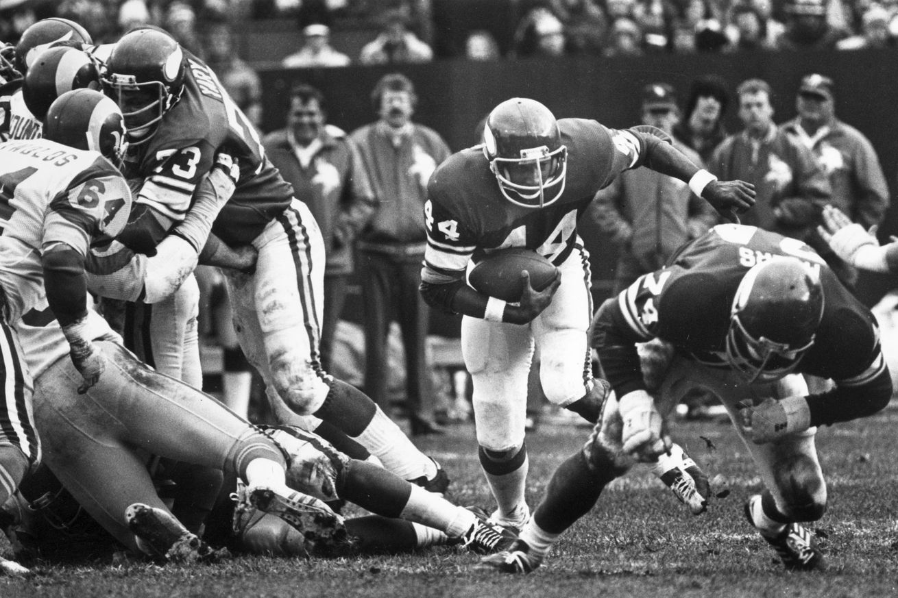Minnesota Vikings pro football Chuck Foreman (#44, center) runs the ball while Ron Yary (#73, left center) blocks vs. the Los Angeles Rams, Oct. 15, 1978. Minneapolis Tribune (now Star Tribune) photo by Bruce Bisping.(Photo By BRUCE BISPING/Star Tribune v