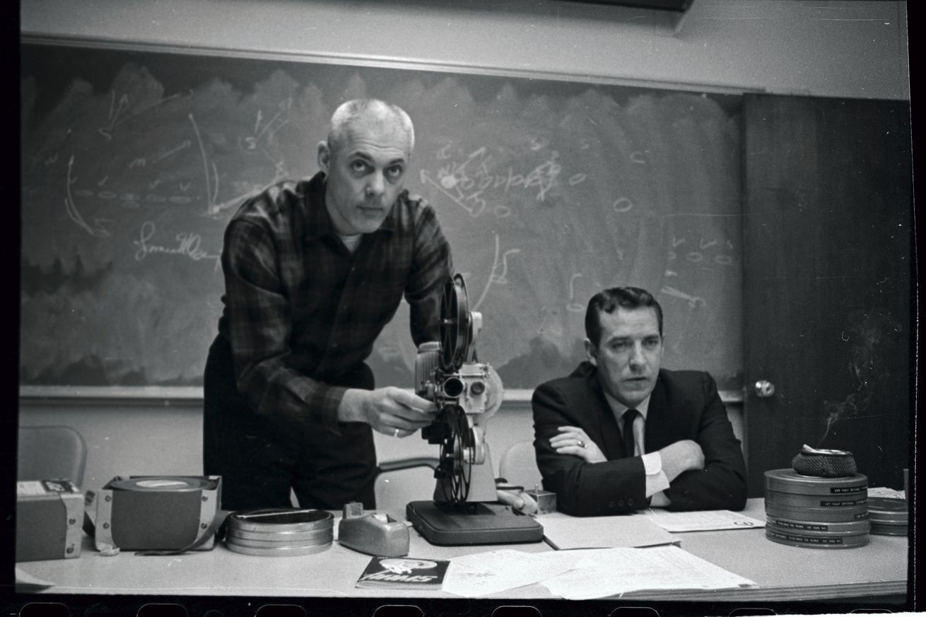 Coach Adjusting Film Projector