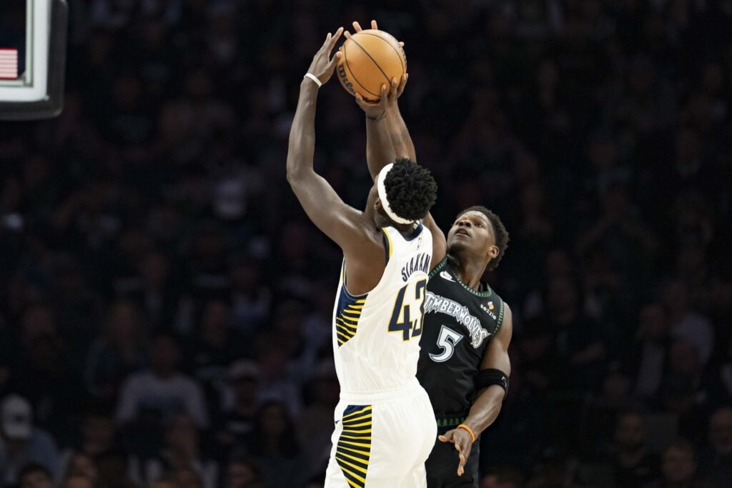 Oct 26, 2025; Minneapolis, Minnesota, USA; Minnesota Timberwolves guard Anthony Edwards (5) blocks a shot from Indiana Pacers forward Pascal Siakam (43) in the first half at Target Center. Mandatory Credit: Jesse Johnson-Imagn Images